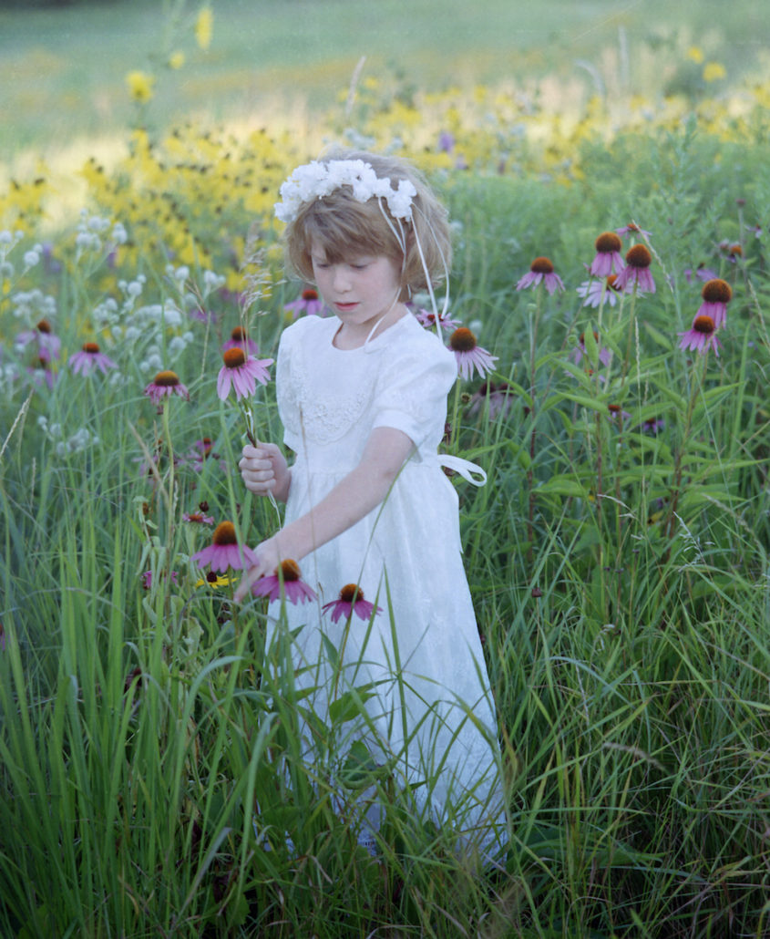 Emma picking flowers